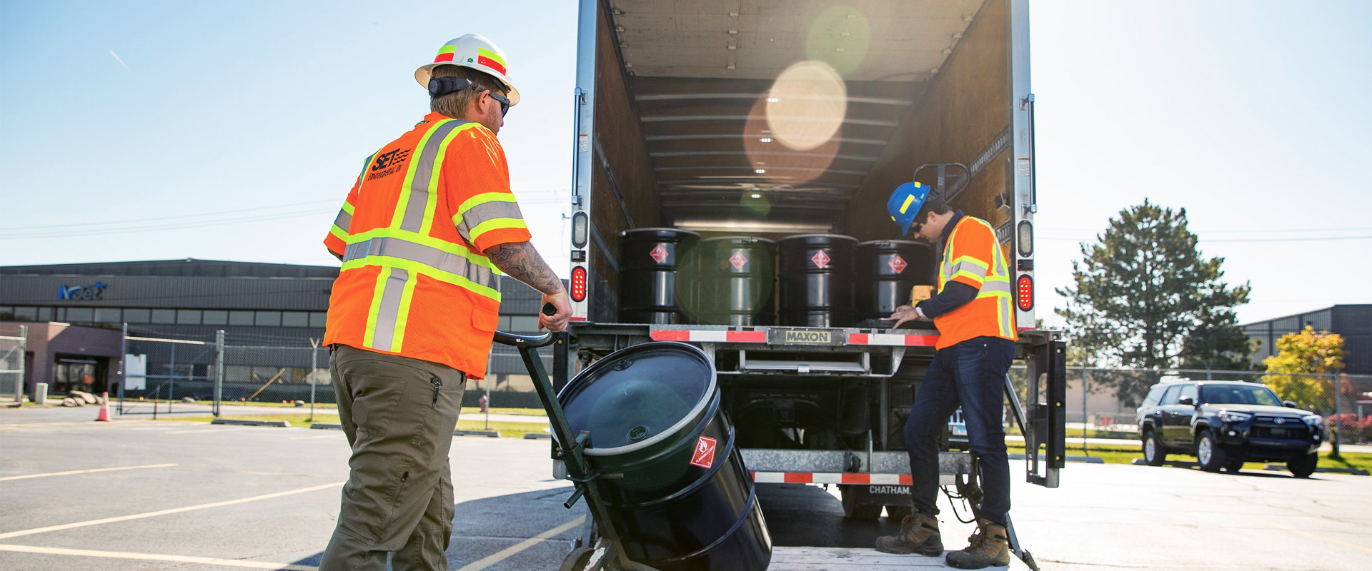 Waste management workers loading truck